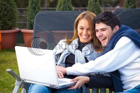 happy-young-couple-surfing-the-internet