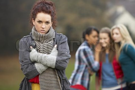 teenage-girl-with-friends-gossiping-in-background